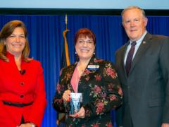Col. Kathy Swacina, USA (Ret.) (c), receives the 2019 Women’s Appreciation Award from DeEtte Gray, AFCEA chairwoman of the board, and Lt. Gen. Robert Shea, USMC (Ret.), AFCEA president and CEO.