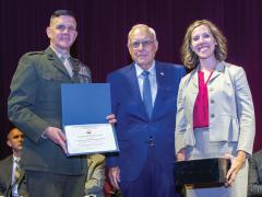Lt. Gen. Otto Guenther, USA (Ret.) (c), presents the AFCEA “Sparky” Baird Award for Research Excellence in June to Maura K. Styczynski for her paper “Blockchain: Buzzword or Breakthrough” at the Dwight D. Eisenhower School for National Security and Resource Strategy alongside the school’s commandant, Maj. Gen. John Jansen, USMC.