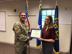 Undergraduate STEM Diversity Scholarship winner Lara Quiring receives her certificate from Col. Sean Murphy, USAF, chapter president, at the Greater Omaha Chapter luncheon in August.