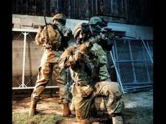 Three soldiers from different forces are equipped with the Integrated Soldier System (ISS) that links the i-Aware TM-NVG night vision system with the SpearNet radio. Combining night vision with radio communications allows warfighters to send real-time battlefield imagery back to their headquarters as well as receive other situational awareness imagery and information from their commands.