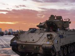 An Army Bradley fighting vehicle armored personnel carrier waits to board a vessel at the port of Bremerhaven, Germany, last October, while supporting Atlantic Resolve, a mission demonstrating continued U.S. support for NATO allies in Europe. The Joint Support and Enabling Command (JSEC) will follow the lead of the Supreme Allied Commander Europe, or SACEUR, in providing deployment assistance in Europe to the U.S. and other NATO militaries. U.S. Army Sgt. Thomas Mort