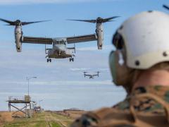 Sgt. Maj. Troy E. Black, USMC, 19th sergeant major of the Marine Corps (r), waits to board an MV-22B assigned to Marine Medium Tiltrotor Squadron (VMM) 162 at Marine Corps Base Camp Lejeune, North Carolina, in January. Maj. Black hosted a Sergeant Major of the Marine Corps Force Level Summit that included a demonstration of the service’s expeditionary advanced base operations concepts. In support of such concepts, the Marine Corps Warfighting Laboratory is positioning itself to provide solutions for Marines