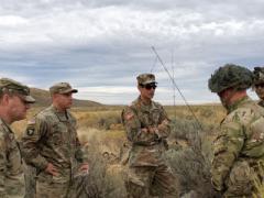 Lt. Col. Brian Wong, USA, chief of market research for the Army’s Network Cross Functional Team (c), assesses the waveform strength of several mobile ad hoc network radio signals during a Rapid Innovation Fund capstone event in 2019 in Yakima, Washington. Engineers at Johns Hopkins’ Applied Research Lab are looking into how to build a large scale network of intelligent radios, among other tactical communications efforts.    USA/PEO C3T Public Affairs