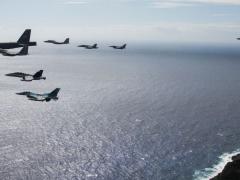 An eight-ship joint coalition formation flies over Andersen Air Force Base, Guam, during exercise Cope North 2020 in February 2020. Guam is proving to be a strategic hub for the United States’ efforts in the Indo-Pacific region, the military’s priority theater.  U.S. Air Force photo by Master Sgt. Larry E. Reid Jr.