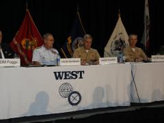 Commanders from the three sea services describe their requirements in a panel discussion at WEST 2022. Photo by Michael Carpenter