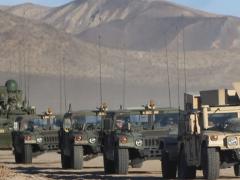 A convoy of Army vehicles equipped with mobile Warfighter Information Network-Tactical (WIN-T) systems enable mobile mission command, advanced communication and real-time common operating picture from anywhere on the battlefield. WlN-T is one system supported by the Army's Communications-Electronics Command under new initiatives aimed at resolving issues with outdated and unpatched software. U.S. Army photo courtesy of the National Training Center, Fort Irwin, California