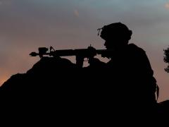 A soldier reacts to a mock opposition forces attack during training at Fort Irwin, California, in June. Cybersecurity projects within the Office of the Chief Information Officer/G-6 will improve cybersecurity for tactical systems. Credit: Air National Guard Master Sgt. Joshua Allmaras