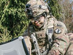 Conceptually, soldiers wearing the tactical identification and authentication tokens could simply approach a system to log in and be recognized by that system, which prompts them to enter a personal identification number or to use a biometric as a second authentication factor. They also may be automatically logged out when they walk away. Credit: U.S. Army