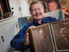 The late Hugh Montgomery, a former ambassador who retired from the CIA in 2014 after serving the intelligence community for more than six decades, displays photographs from his younger days.