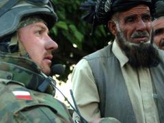 A Polish army officer talks with village elders in the Ghazni province of Afghanistan. U.S. Army officials are discussing the need to include international partners and allies in the Joint All-Domain Command and Control concept, which is expected to dramatically improve interoperability. U.S. Army photo by Spc. Micah E. Clare