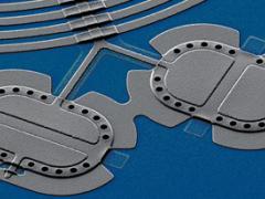 NIST researchers entangled the beats of two mechanical drums—tiny aluminum membranes each made of about 1 trillion atoms—and precisely measured their linked quantum properties. Entangled pairs massive by quantum pairs might someday perform computations and transmit data in large-scale quantum networks. Credit: John Teufel/NIST