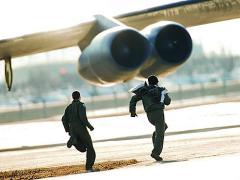 Alerted by the Global ASNT system, aircrews rush to their B-52H Stratofortresses during a training exercise at Minot Air Force Base in November.