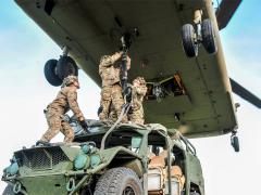 Army paratroopers sling-load a ground mobility vehicle to a CH-47 Chinook helicopter during a September 2019 Saber Junction exercise in Germany. Army officials intend to invest heavily in multidomain operations in the coming years. Credit: Army Sgt. Henry Villarama