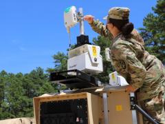 Staff Sgt. Keila Peters, USA, an embedded noncommissioned officer within the Army C5ISR Center, conducts testing on equipment for the command post survivability effort during Network Modernization Experiment 20 at Joint Base McGuire-Dix-Lakehurst, New Jersey, July 27, 2020. The Army's new deputy chief of staff for G6 has laid out three pillars for his restructured office that include cyber, signal, electronic warfare and networking priorities. Credit: U.S. Army C5ISR Center photo/Jasmyne Douglas
