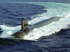 The U.S. Navy’s nuclear ballistic submarine USS MAINE, one of the nation’s newest Ohio class submarines, conducts surface navigational operations approximately 50 miles due south of Naval Station Roosevelt Roads, Puerto Rico. The Naval Research Laboratory’s cryptographic system now destined for aircraft has already been integrated onto the Navy’s nuclear fleet.