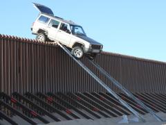 Smugglers used a makeshift ramp to attempt to drive over a border fence in 2012 but fled when the truck didn’t make it over. Jeh Johnson, secretary of the Homeland Security Department, is calling for a 2015 appropriations bill to fund more technology to help secure the southern border.
