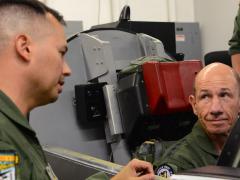 Gen. Mike Holmes, USAF, commander of Air Combat Command (r), receives a brief on U-2 Dragon Lady ejection procedures from Lt. Col. Charles, 9th Operations Group deputy commander, at Beale Air Force Base, California. Holmes visited the 9th Reconnaissance Wing, where he was immersed in all aspects of the reconnaissance mission. U.S Air Force photo by Senior Airman Tristan D. Viglianco