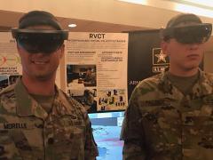 Lt. Col. Dylan Morelle (l), USA, demonstration officer, Synthetic Training Environment Cross-Functional Team and Spc. Cody Palmer, USA, 2nd Armored Brigade Combat Team, 1st Infantry Division, demonstrate the Army’s One World Terrain platform.