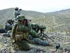 U.S. Army and Marine forward observers train jointly at the National Training Center in Fort Irwin, California. Joint operations will continue to be a challenge without top-down coordination to ensure interoperability early in system development.