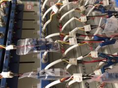 Solid-state batteries, attached by blue clamps, are tested at the University of Texas at Austin’s Cockrell School of Engineering. These batteries offer the promise of greater power density and faster recharge times than lithium-ion batteries for everything from handheld devices to electric cars.