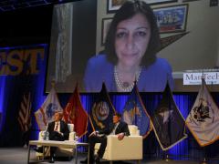 Rep. Elaine Luria (D-VA) appears on a video screen above fellow panelist Elbridge A. Colby (l), co-founder and principal, the Marathon Initiative, and panel host Adm. William F. Moran, USN (Ret.), former vice chief of naval operations, in the opening session of day 2 at WEST 2022 in San Diego. Photo by Michael Carpenter