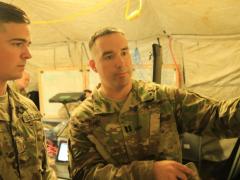 2nd Lt. Shane Neal, USA, receives guidance from Capt. Douglas Gain, USA, as they review the Cyber and Electromagnetic Activities Team’s plans during Exercise Saber Junction 2019 at the Grafenwoehr Training Area, Germany. Credit: U.S. Army