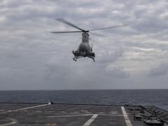 An MQ-8B Navy Fire Scout hovers over the flight deck of the Independence-variant littoral combat ship USS Montgomery in the South China Sea in January 2020. The Navy is exploring how to apply the Future Airborne Capability Environment, or FACE, open architecture to unmanned platforms such as the Fire Scout.  U.S. Navy photo by Mass Communication Specialist 2nd Class Chris Roys