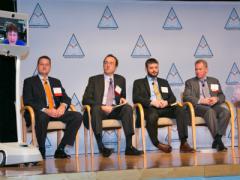 Dallas Goecker joins a panel discussion on mobility from Indiana via a robotic telepresence device developed by Suitable Technologies to facilitate remote collaboration. Goecker was a panelist at Mobile Tech Summit held in Washington, D.C. Photo by Mike Carpenter