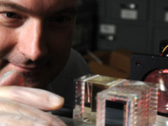 NRL's Christoph Englert examines the prototype Michelson interferometer (MIGHTI) being developed at NRL for flight on NASA's ICON mission.