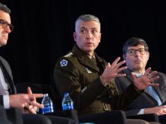 Gen. Paul Nakasone, USA (c), commander, U.S. Cyber Command, speaks on a panel at the Intelligence and National Security Summit. Photo by Herman Farrer