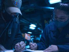 Operations officers stand watch in the combat information center of the USS John S. McCain as the destroyer transits the Taiwan Strait. The U.S. Navy's contribution to the Joint All-Domain Command and Control (JADC2) system is a high priority for Adm. Michael M. Gilday, USN, the chief of naval operations. Credit: U.S. Navy photo