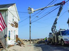Crews work in New Jersey to restore power that was knocked out during Hurricane Sandy. GridCloud, a project between Cornell University and Washington State University, employs cloud technology to make smart grids self-healing and more resilient in the event of natural or man-made disasters. Photo Credit: FEMA/Liz Roll
