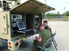 The U.S. Marine Corps is developing a private cloud computing environment to provide better information services to the tactical edge. Here, communicators set up a Support Wide Area Network System during a training exercise.