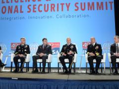 A phalanx of U.S. intelligence chiefs review the community's progress to close out the Intelligence & National Security Summit. Pictured are (l-r) panel moderator David Ignatius, associate editor and columnist, The Washington Post; Lt. Gen. Paul M. Nakasone, USA, commander, CYBERCOM and NSA; Christopher Scolese, director, NRO; Lt. Gen. Robert P. Ashley, USA, director, DIA; Vice Adm. Robert Sharp, USN, director, NGA; and Paul Abbate, associate deputy director, FBI. Credit: Herman Farrer Photography