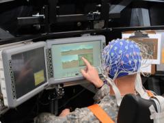A soldier operates systems in a simulated tank while scientists at the Army Research Laboratory (ARL) monitor his brain waves. This work by the ARL’s Combat Capabilities Development Center seeks to establish how artificial intelligence can be employed to address a soldier’s needs by determining changes in the human’s mood. ARL photo