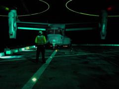 An aviation support equipment technician directs an MV-22B Osprey on the deck of the USS San Diego in the South China Sea. Operations in the vast Indo-Asia-Pacific region are increasing in complexity concurrent with rising challenges.