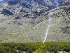 Smoke rises from an unmanned aerial vehicle after it was engaged by a counter system in March during the Hard Kill Challenge in New Mexico. Sponsored by the Defense Threat Reduction Agency (DTRA) and the Joint Improvised-Threat Defeat Organization (JIDO), the challenge focused on stopping the growing threat posed by unmanned aerial systems. Photo by 1st Lt. Chelsi Spence, USAF, DTRA