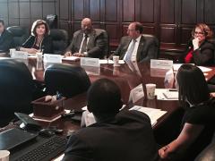 The Small Business Committee gathers for a presentation on teaming agreements by Marques Peterson and Kelly Buroker of Vedder Price.