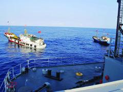 Two Chinese trawlers stop directly in the path of a U.S. Navy ocean surveillance ship in international waters in the South China Sea, forcing the ship to conduct an emergency all-stop to avoid a collision. China employs a broad spectrum of vessels ranging from “civilian” fishing boats to armed navy warships to enforce its claims to multiple territories in and around the South China Sea.