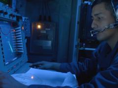 A U.S. Navy cryptologic technician monitors the electromagnetic spectrum of air and surface contacts in the combat information center aboard the guided-missile destroyer USS Ramage in 2014.