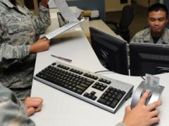 A U.S. airman with the 81st Force Support Squadron resets her common access card (CAC) personal identification number. U.S. Air Force photo by Kemberly Groue