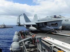 The LCS USS Independence conducts maneuvers with the aircraft carrier USS Ronald Reagan (CVN 76) during Rim of the Pacific 2014.