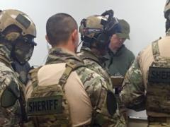 SWAT teams receive a training scenario briefing during September’s Urban Shield in California.