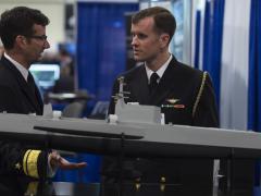 Rear Adm. Christian "Boris” Becker, USN, commander, SPAWAR (l), discusses naval capabilities with another officer while visiting the Office of Naval Research and Naval Research Laboratory  exhibit at the Navy League’s Sea-Air-Space Exposition last year. SPAWAR System Command’s recent Other Transaction Agreement (OTA) award for its Information Warfare Research Project  will drive key innovative information warfare capabilities to the Navy, Rear Adm. Becker says. Credit: U.S. Navy photo by John F. Williams