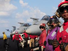 Sailors stand by while an F/A-18 Hornet launches from the flight deck of Nimitz-class aircraft carrier USS Dwight D. Eisenhower in 2012. The Navy’s use of modular open architecture solutions allows the service to bring rapid updates to legacy platforms, including as part of its F/A-18 Distributed Targeted Processor-Networked effort.  U.S. Navy photo by Mass Communication Specialist Seaman Sabrina Fine