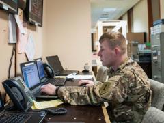 A network operations battle noncommissioned officer with the DHHB, 1st Infantry Division, monitors the CJFLCC-I network near the command’s operations center in Iraq. The network employs both Iraqi and U.S. communications capabilities to link diverse forces, along with surveillance and reconnaissance assets, over the country’s rugged terrain.