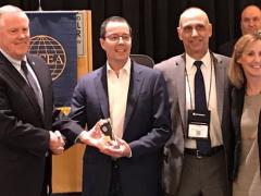 From l-r, Lt. Gen. Robert Shea, USMC (Ret.), president and CEO of AFCEA International, presents the winner’s trophy to Mike Fong, CEO of Privoro, after his company’s technology was chosen as the top competitor in the championship round of AFCEA International’s small business innovative shark tank. Also present are John Kreger of MITRE, chairman of the AFCEA Homeland Security Committee and Tina Jordan, AFCEA vice president of membership.
