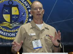 Rear Adm. Douglas Small, USN, commander, Naval Information Warfare Systems Command, describes aspects of Project Overmatch at WEST 2022. Photo by Michael Carpenter