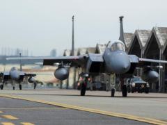U.S. Air Force F-15 Eagles flying for the U.S. Pacific Command taxi near a runway at Kadena Air Base, Okinawa, Japan. North Korean hackers stole wing designs for the F-15 from a South Korean company in a series of cyber attacks over a two-year period.