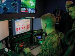 Marines with Marine Corps Forces Cyberspace Command work in the cyber operations center at Lasswell Hall, Fort Meade, Maryland. MARFORCYBER Marines conduct offensive and defensive cyber operations in support of U.S. Cyber Command and operate, secure and defend the Marine Corps Enterprise Network. Credit: Staff Sgt. Jacob Osborne, USMC